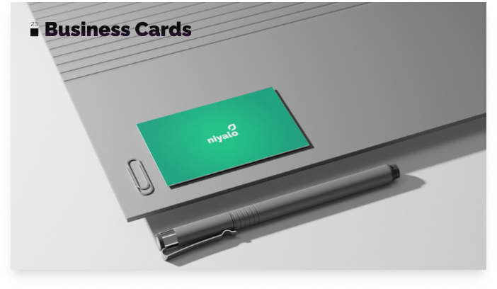 Business card mockup with niyalo logo on a desk setting.